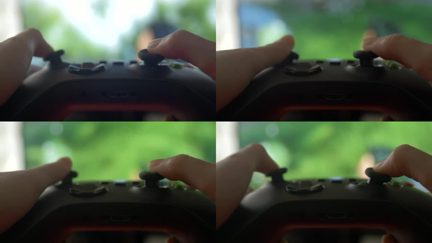 玩家手使用操纵杆在主机上玩视频游戏的特写。孩子在电脑游戏中玩黑色控制器。手的人玩视频游戏的控制台与手