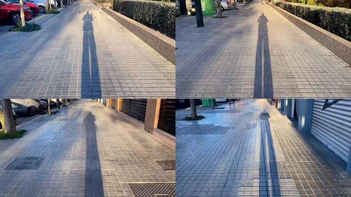 长长的影子在人行道上流逝