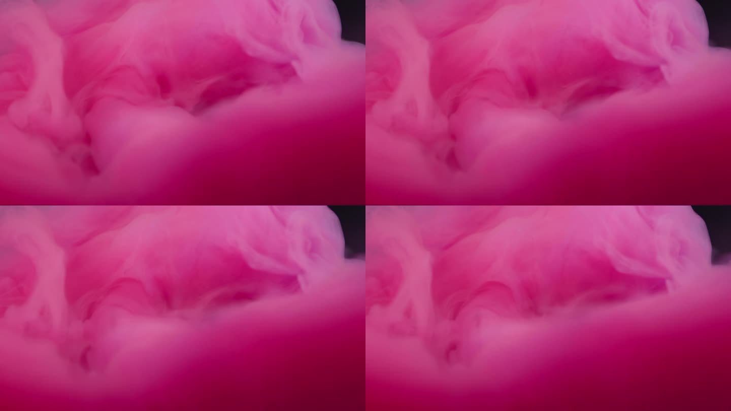 近距离慢动作的粉红色丙烯酸彩色墨水在水中，像一个爆炸或云