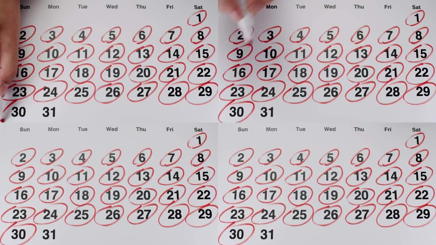 年轻女子用红色记号笔在月历上圈出所有日期