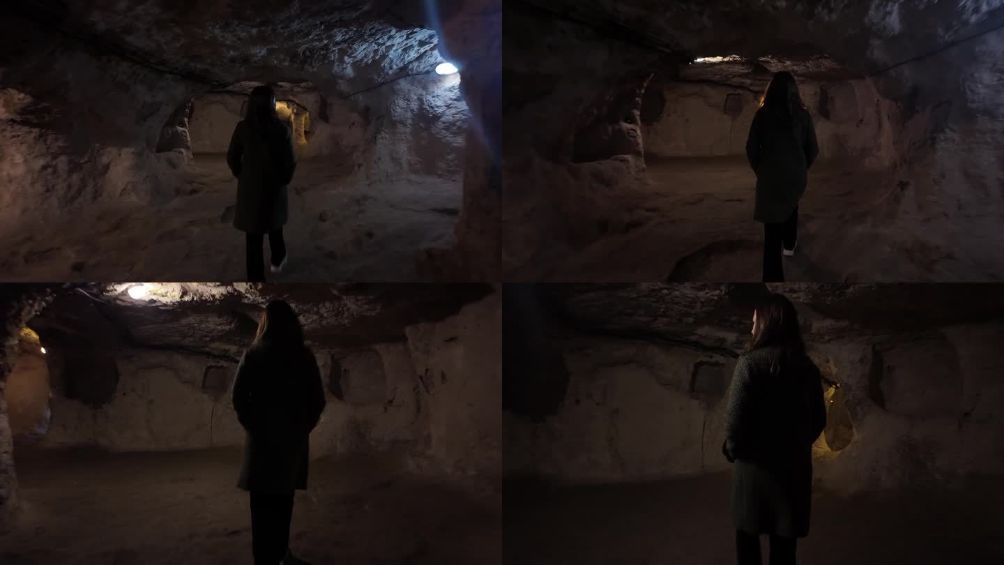 在公元前1200年建于土耳其卡帕多西亚的Derinkuyu地下城，一名年轻女子走在狭窄的隧道中。