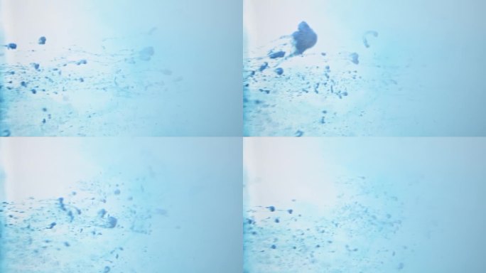 蓝色背景和水中抽象粒子的运动，类似于水母或微生物