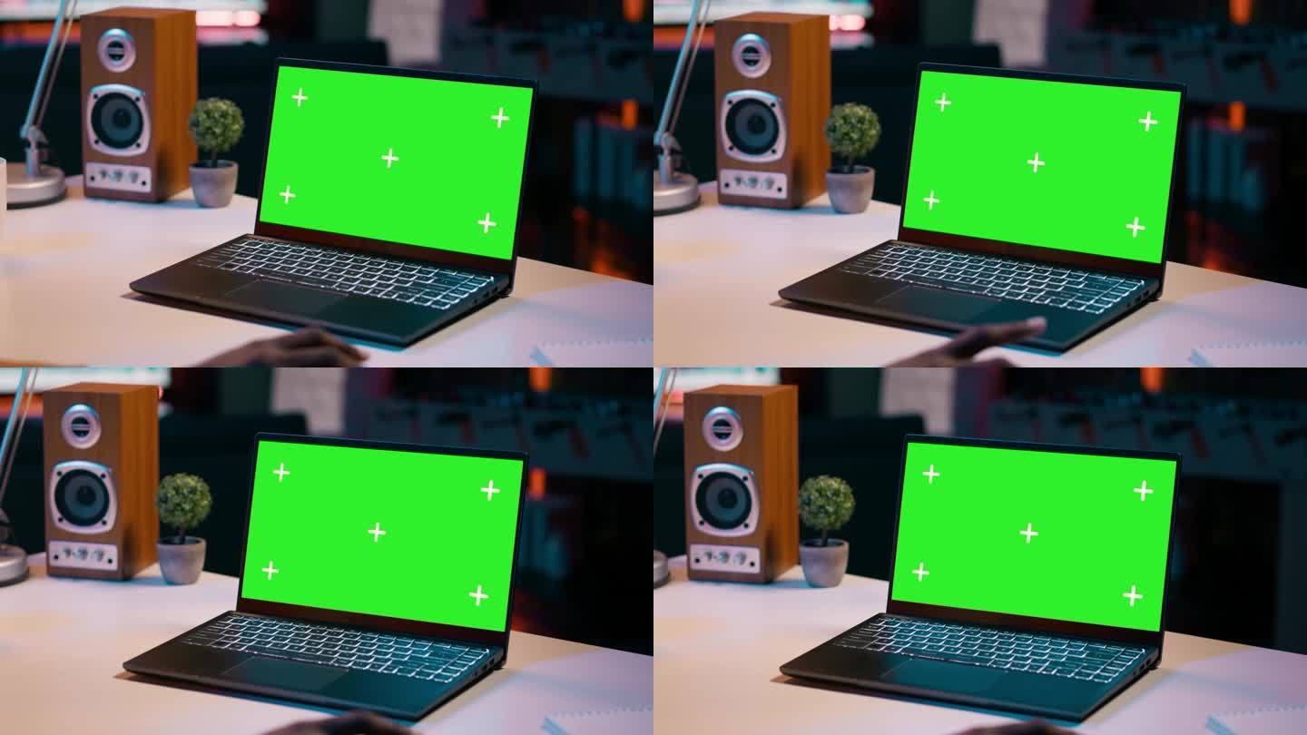 大学生在家里检查笔记本电脑的绿屏显示