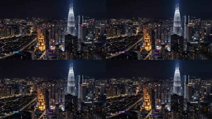 吉隆坡航拍夜景，灯火通明的双子塔巍然屹立