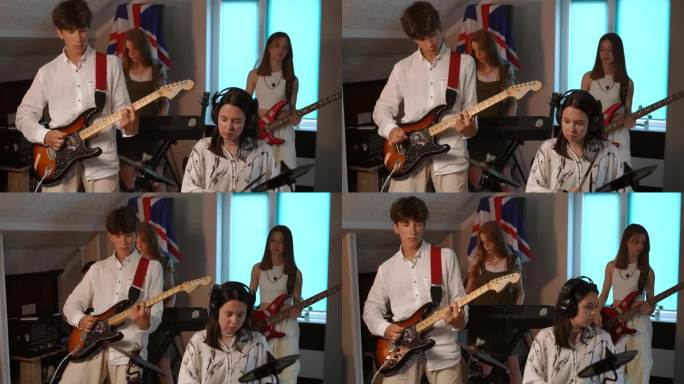 一个四人组合正在一所音乐学校排练。音乐家们站在墙上挂着英国国旗的房间里，排练英国摇滚乐队的热门曲目。