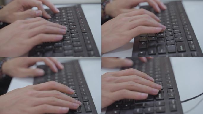 一只手正在敲键盘打字工作加班创作码字计算