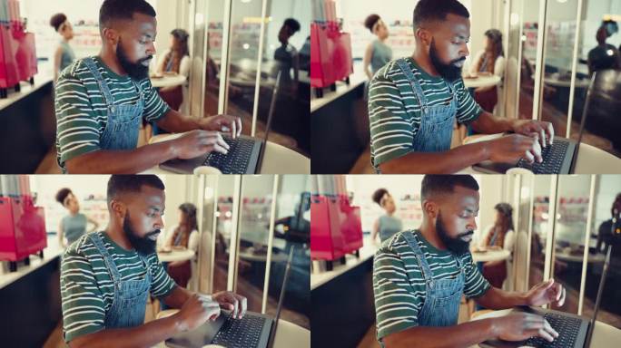 咖啡馆，有创造力的黑人，带着笔记本电脑，和记者一起打字或思考，在线阅读或研究。非洲人，编辑或作家在咖