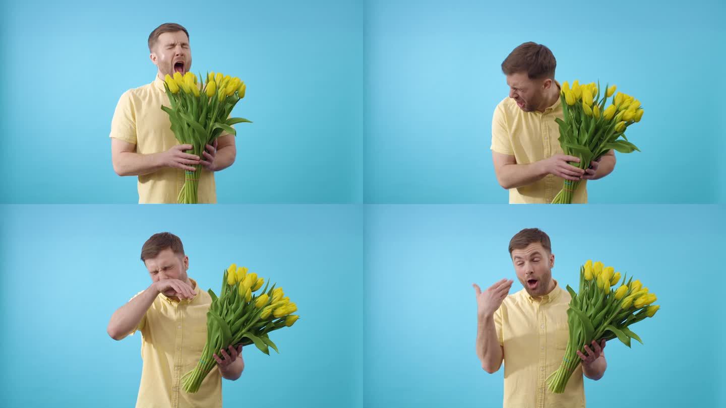 男人闻着一束黄色的花，在蓝色的背景上打喷嚏