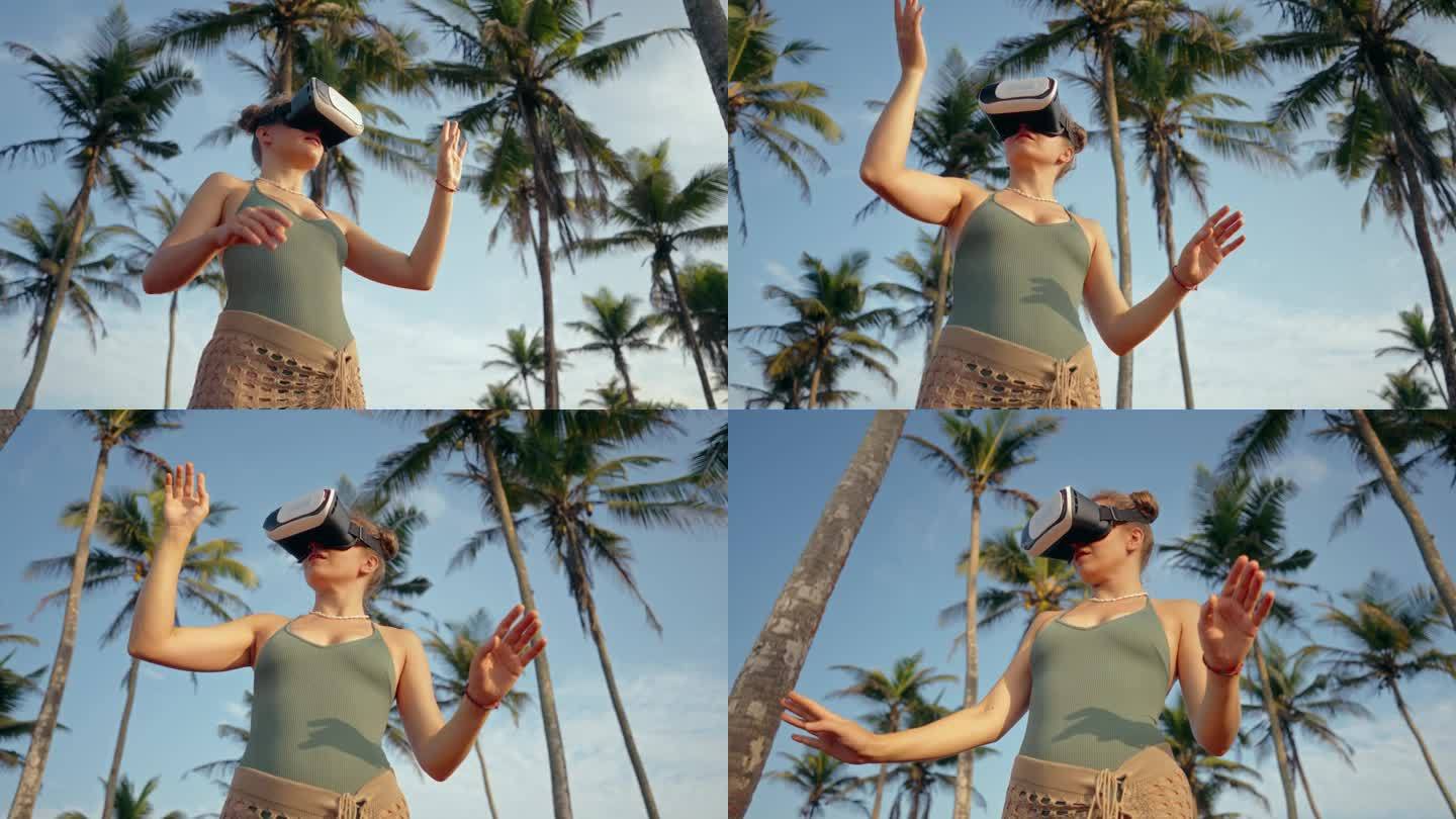 年轻女子探索虚拟环境，在棕榈树中戴着VR耳机。交互技术仿真，用户手势在身临其境的数字世界。女性参与增
