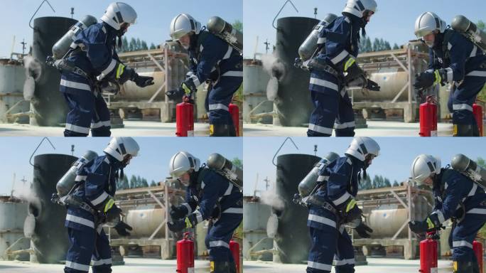 专业消防员训练，女消防员穿着防护服练习灭火器