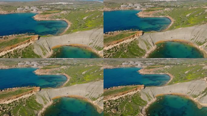 著名的马耳他湾的无人机视图。春天，绿色的乡村。加恩·图菲哈，马耳他岛