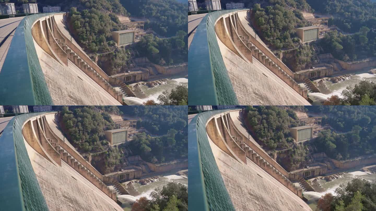 水电大坝有水流通过的闸门。西班牙的重力水电站大坝正在抽水。