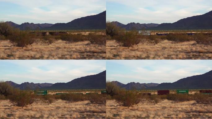 日落时分，亚利桑那州沙漠中的黄色干草，凤凰城附近的一列火车