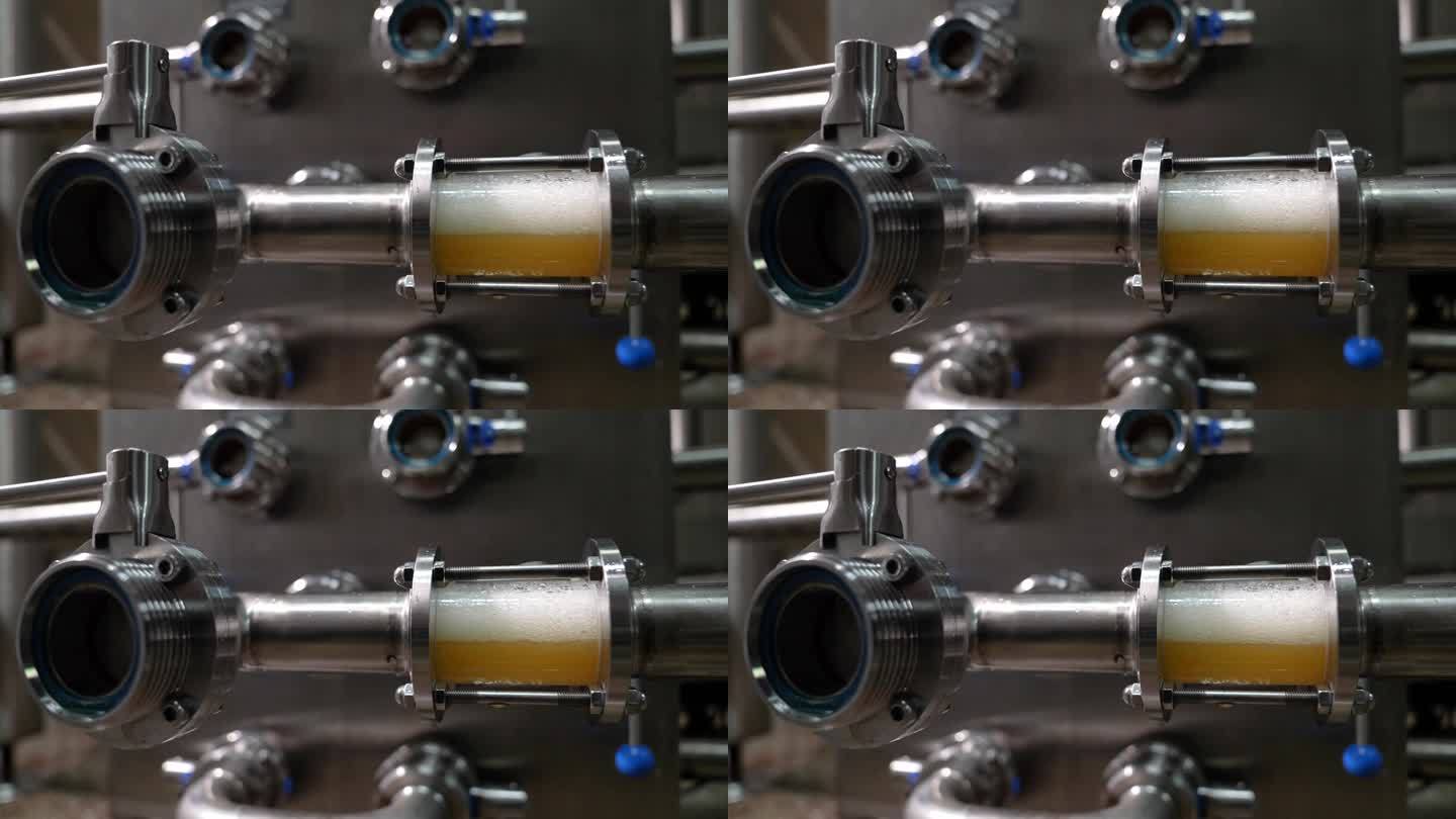 精酿啤酒工厂。用烟斗装啤酒，用桶装啤酒的大容器。过滤在管道中过滤啤酒的过程