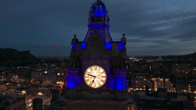 Aerial view of clock tower and scottish flag in Ed