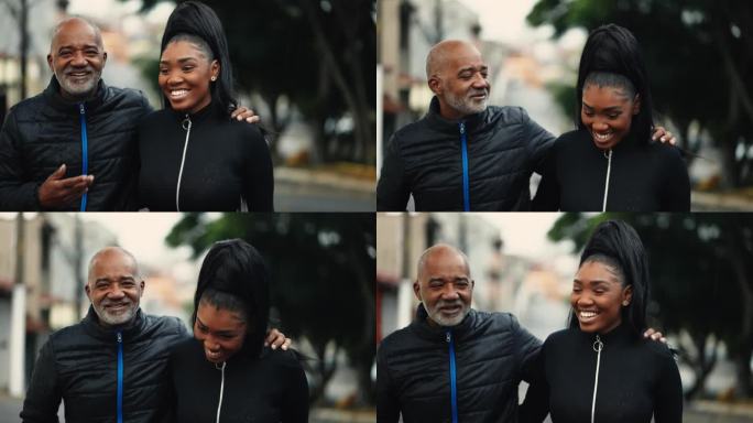 快乐的中年父亲和十几岁的女儿一起漫步在城市的街道上。父亲搂着孩子向前走，一边给孩子建议