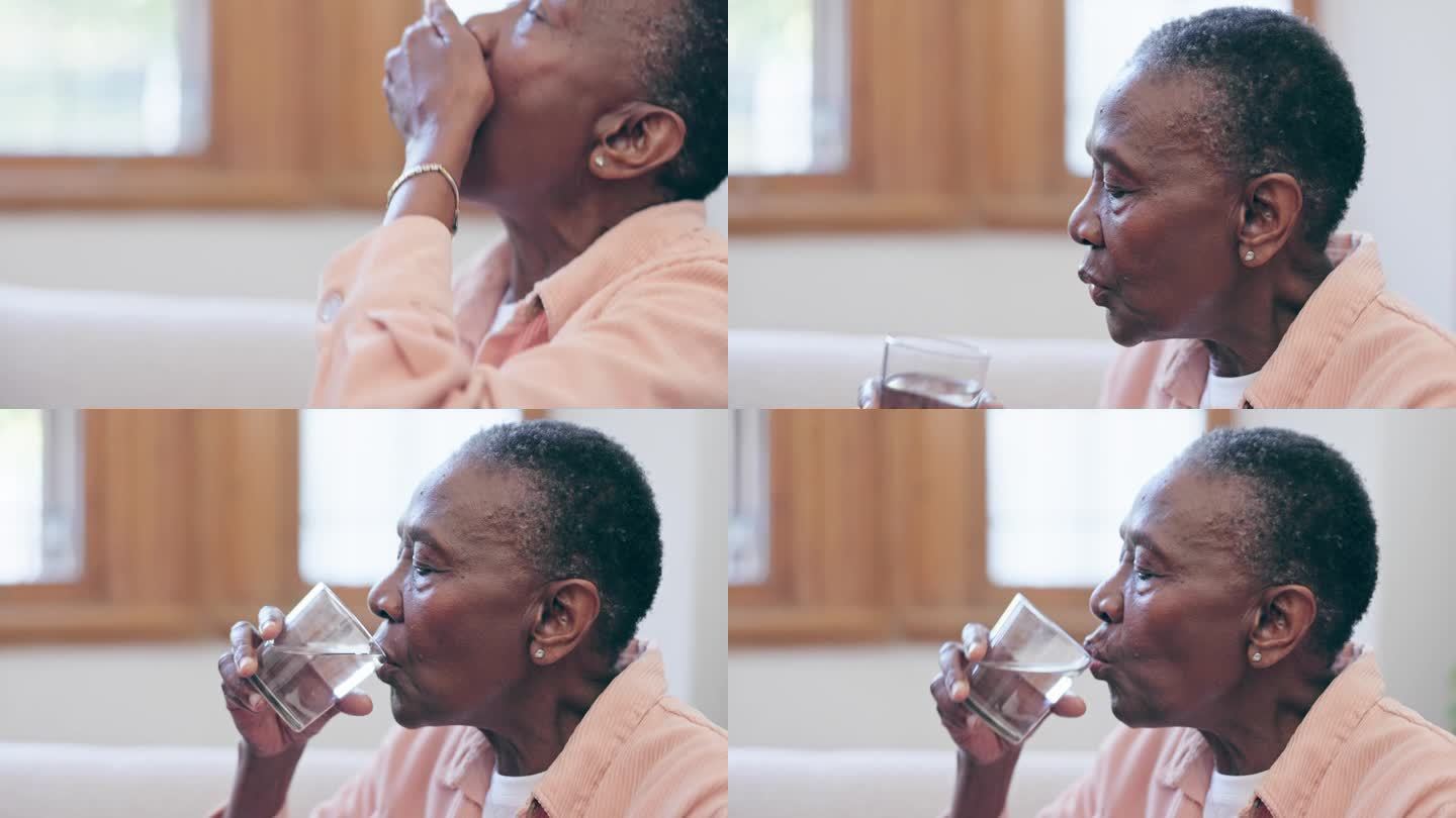 在专业护理人员的帮助下，一位住在养老院的黑人妇女得到了药片、杯子和水。药物、药片或处方治疗和一位老年
