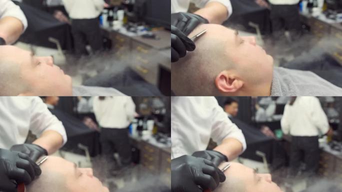 一名男子在用剃刀剃须时，蒸汽发生器喷出的热蒸汽湿润了他的头部