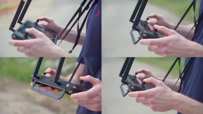 驾驶无人机。无人机操作员的手特写，而飞行员四轴飞行器遥控器户外自然。现代技术概念智能数字无线设备。专