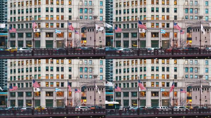 美国伊利诺斯州芝加哥市中心的现代建筑中，悬挂美国国旗的芝加哥街桥和交通道路