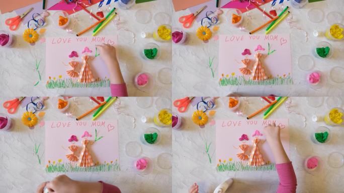 孩子自制贺卡。母亲节，生日或情人节的礼物。工艺美术概念。幼儿园工艺品。儿童创造力项目