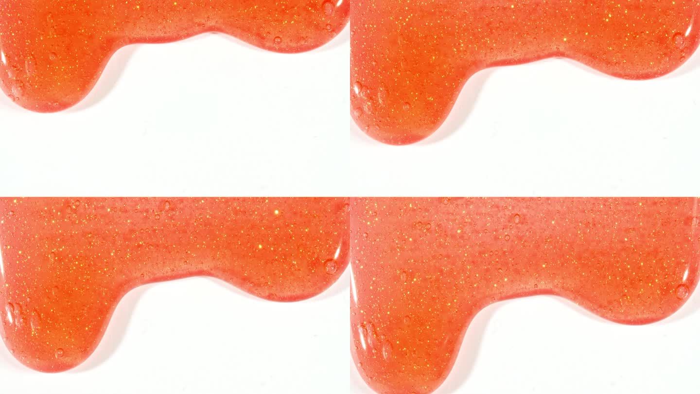 红色化妆品凝胶流体与分子气泡流动在纯白色背景。液体乳霜凝胶。天然有机化妆品、药品微距拍摄。生产特写。