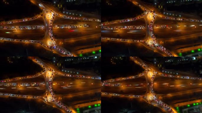 高速公路上的延时车辆在高峰时段交通繁忙的十字路口，现代交叉路口的夜间