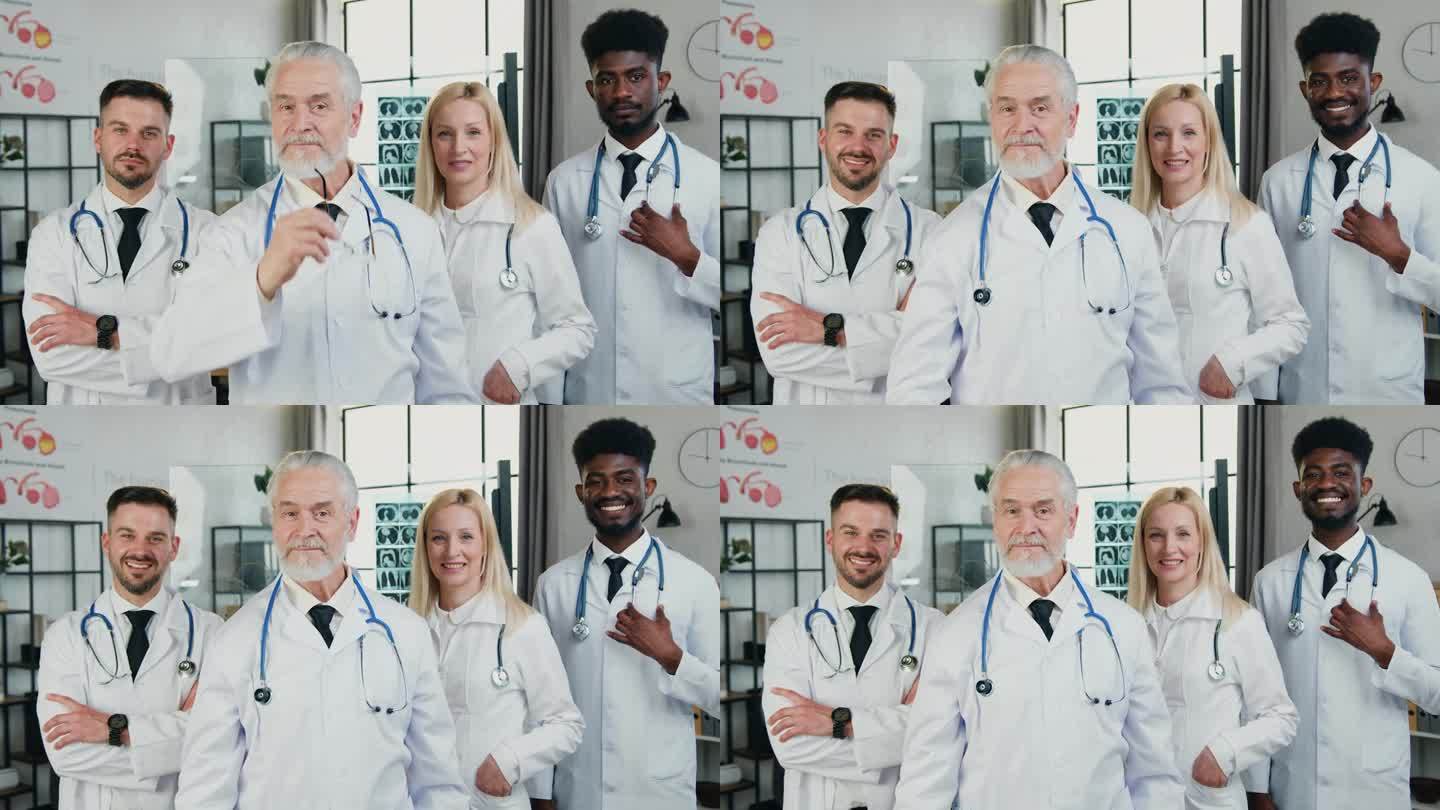 团队医生的肖像，与他的混合种族团队的同事在医疗办公室合影