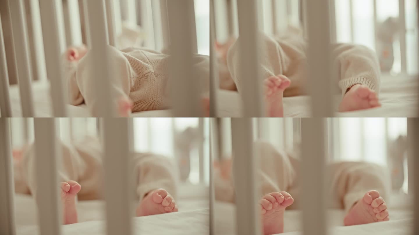 小宝贝:捕捉沐浴在清晨阳光下的婴儿床里的小男孩的脚的嬉戏舞蹈