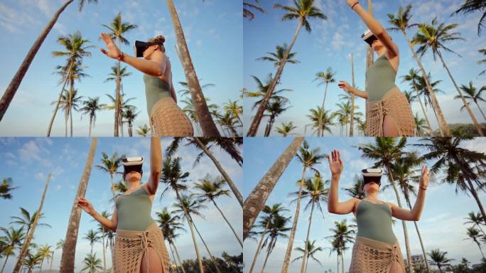 活跃的女性戴着VR眼镜在棕榈树间探索虚拟世界。爱冒险的用户与数字环境互动，在晴朗的天空下沉浸式模拟现
