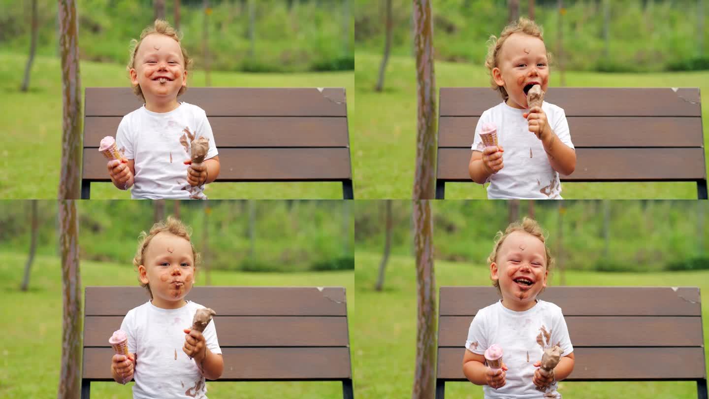 小男孩穿着脏兮兮的t恤，拿着两个融化的冰淇淋甜筒在公园里玩得很开心