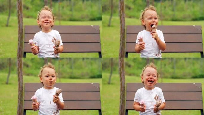 小男孩穿着脏兮兮的t恤，拿着两个融化的冰淇淋甜筒在公园里玩得很开心