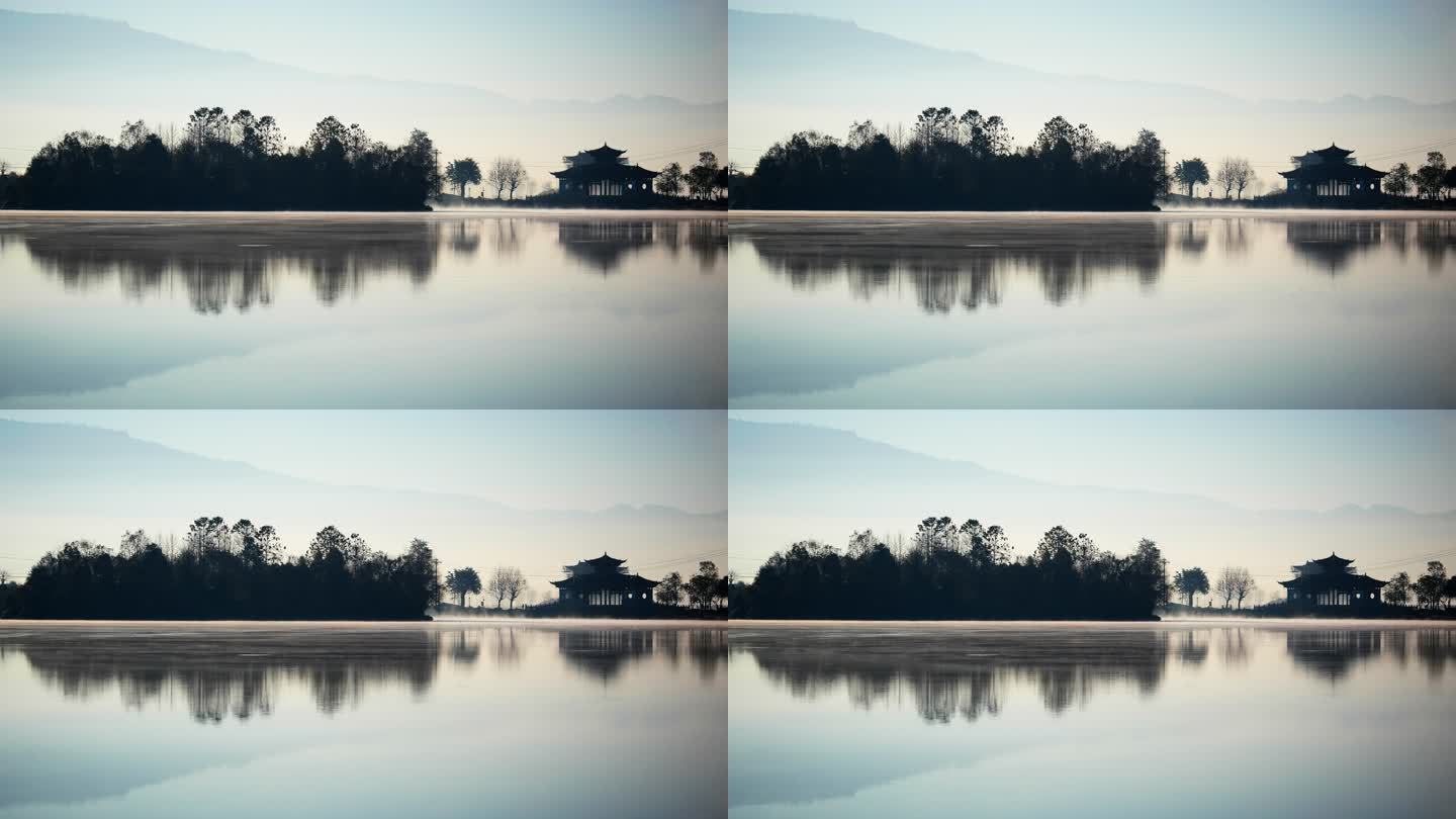 清晨雾气缭绕的湖面，犹如古典水墨山水画