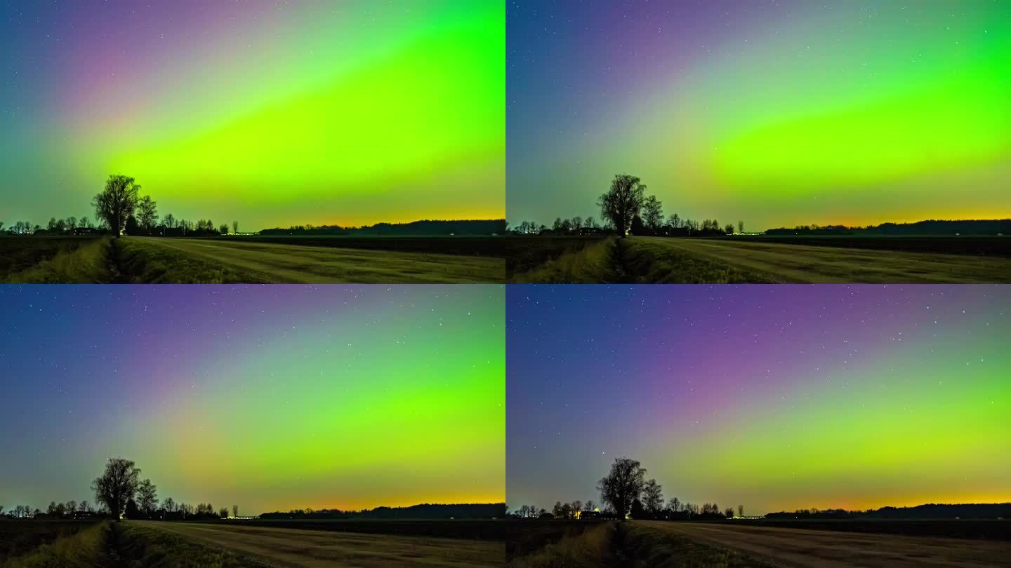 强大的北极光照亮天空，全彩色光谱从红到绿，彗星飞过，星星在背景中。