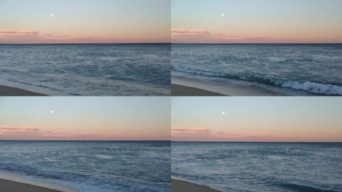平静的大海，沙滩上的满月。晚上看海。