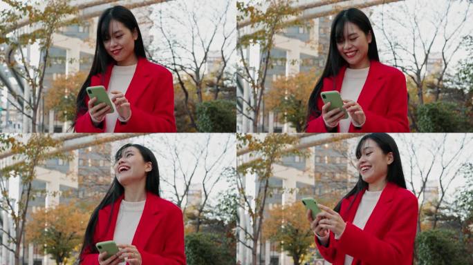 一名日本女子在城市里用手机阅读有趣的通知、社交媒体帖子和下载数字应用程序。快乐的女士在东京的城市公园