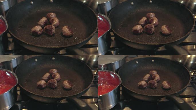 慢动作拉出一组正在煮的肉丸的镜头