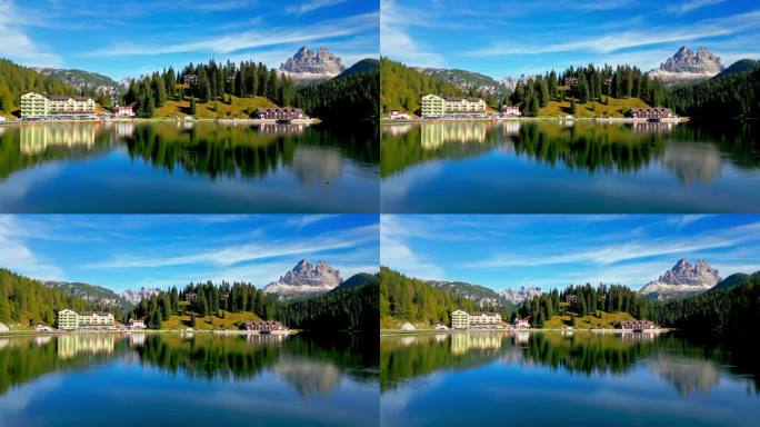 在意大利，欧洲，自然和景观，旅游和旅游目的地，白云石国家公园白天飞越米苏里纳湖的实时镜头，