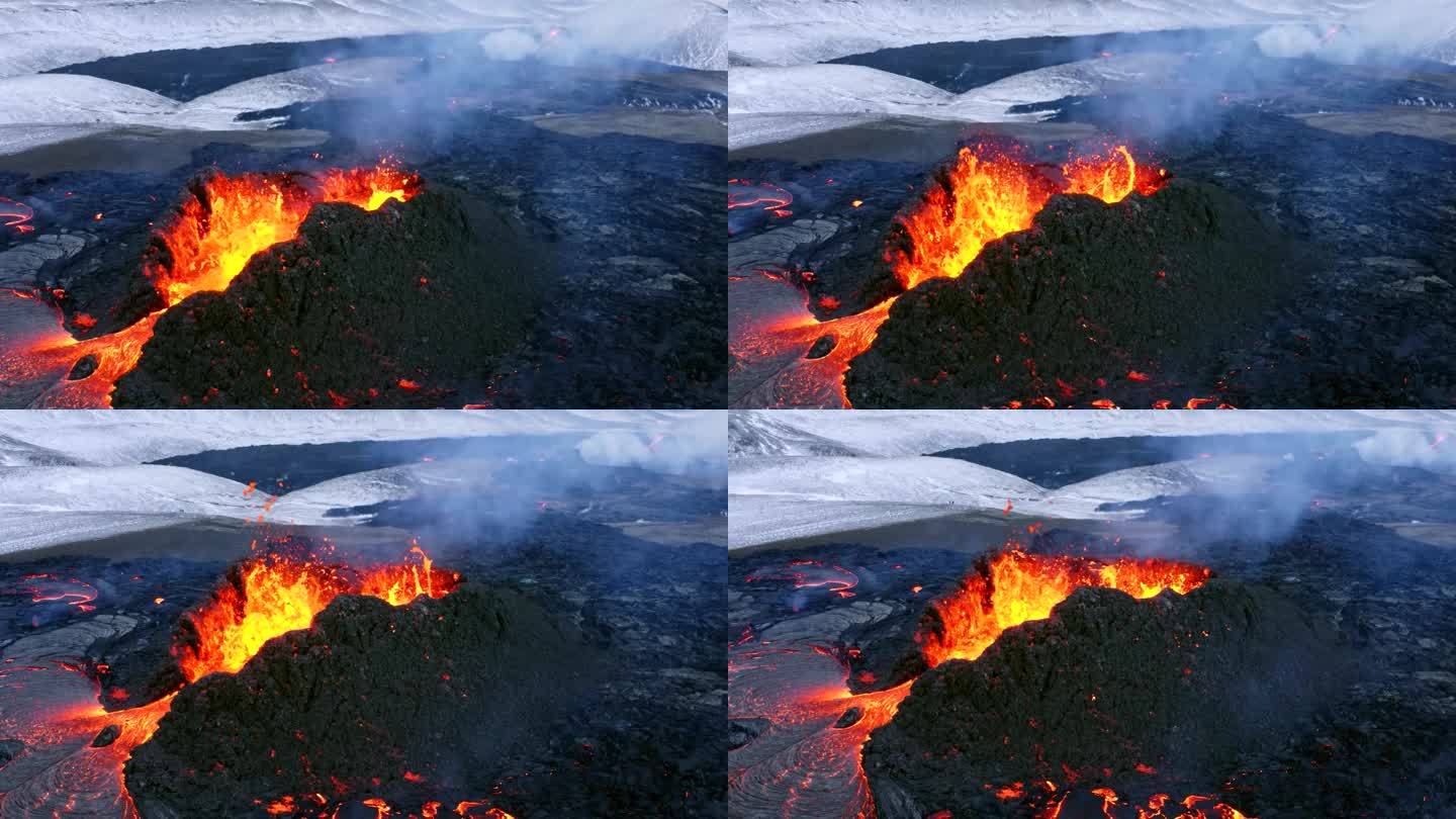 由电影级4K无人机拍摄的航拍画面展示了冰岛一座喷发的火山，快速流动的熔岩和冬日的背景。