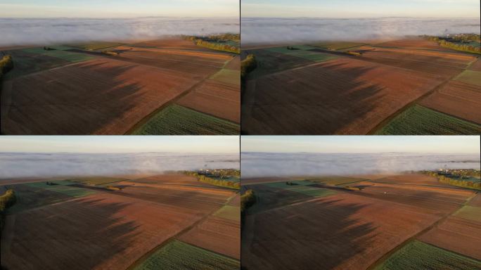 无人机拍摄的雾翻滚在农村农田景观