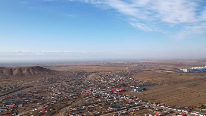 4k新疆伊犁农村城市雪山航拍