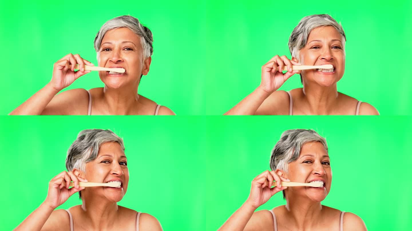 绿屏、老年女性刷牙或用牙膏进行健康口腔卫生修饰。环保，清洁肖像或成熟的人用竹制牙刷美白牙齿