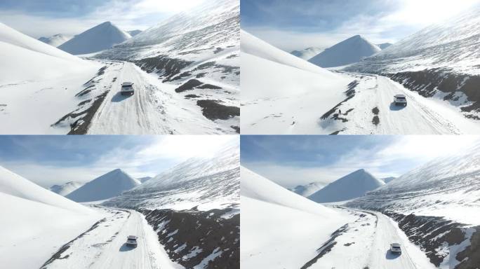 西藏纳木错雪山雪地路虎揽胜极光行车