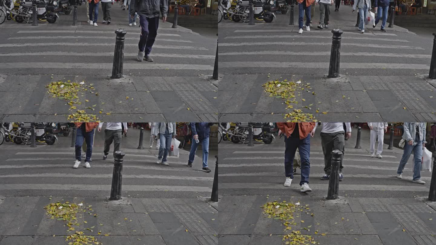 4K实拍广州中山路周末街道行人道上的落叶