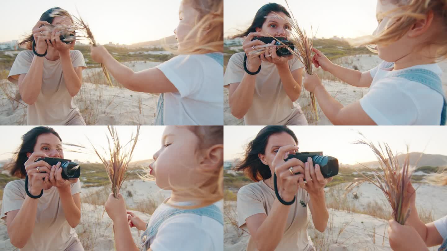 家庭摄影师。一名妇女拿着相机在户外给蹒跚学步的女孩拍照