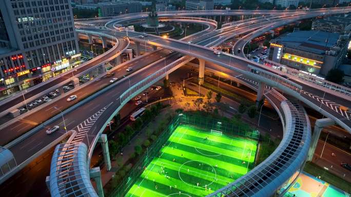 航拍武汉光谷立交桥交通车流和灯光足球场