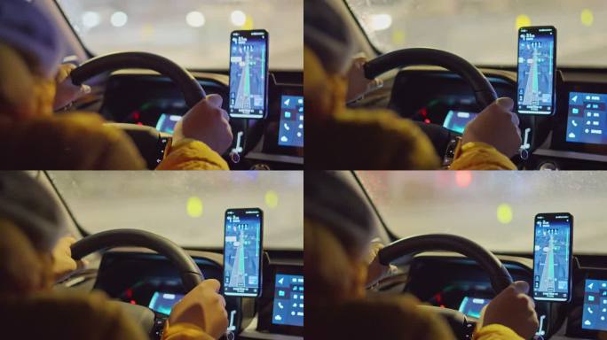 男子在城市街道夜景中驾驶车流并用手机导航