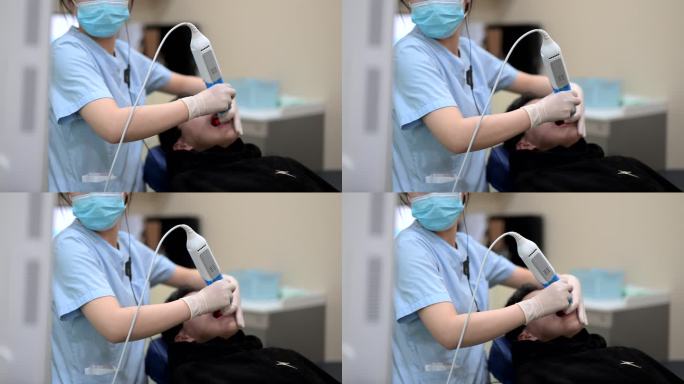 牙科护士在做3D扫描口腔检查
