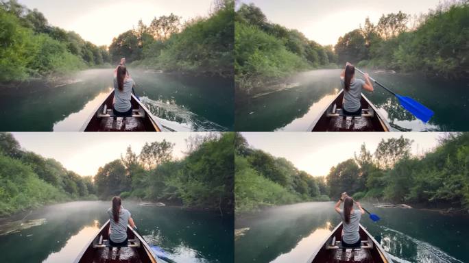 年轻女子在独木舟上探索雄伟的河流