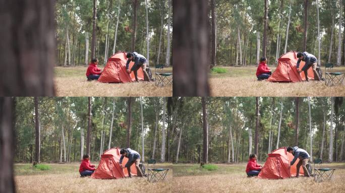 一对旅行者在露营地搭帐篷